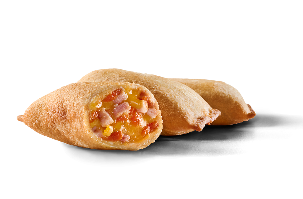 A burrito with corn, ham and cheese.